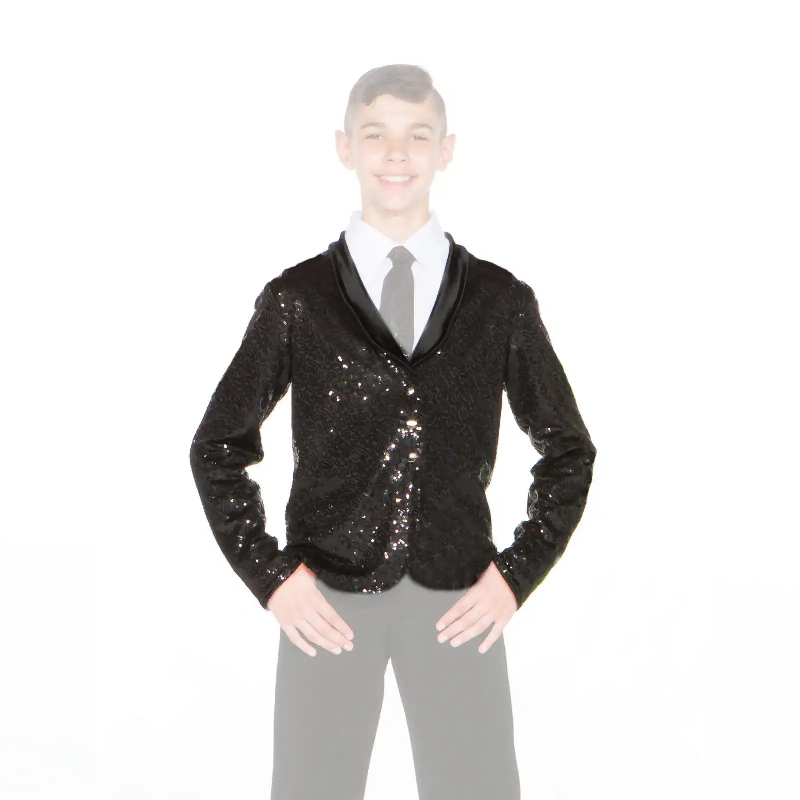 Smiling boy wears a black sequined formal jacket.