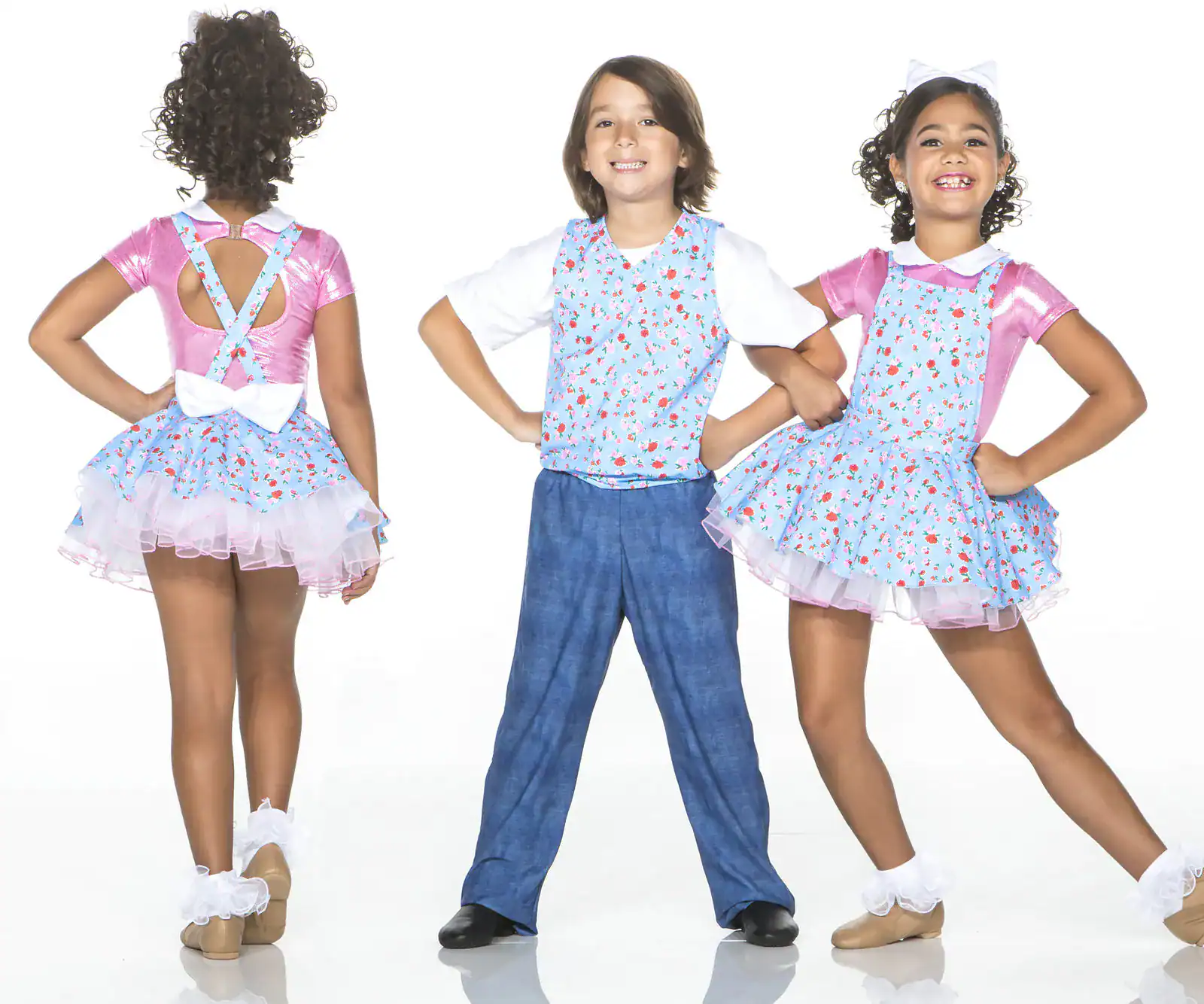 Children modeling matching floral dance costumes
