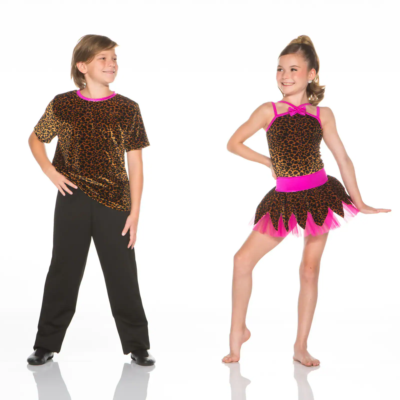 Two children modeling leopard-print dance costumes with pink accents.